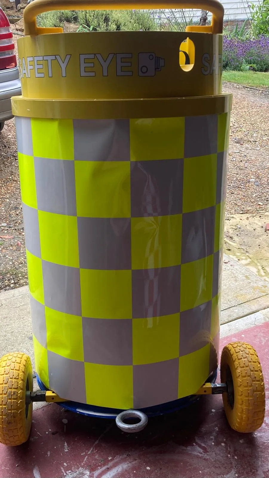 Safety Eye mobile CCTV bollard unit close-up showing hi-vis checkered markings and wheels